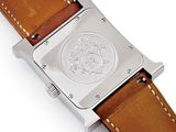 an image of a close up of a watch on a white surface