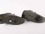 pair of bronze shoes on a white background