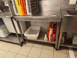 a kitchen with stainless steel cabinets and a sink