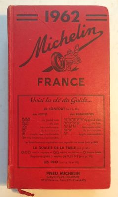 an old red book with a picture of a motorcycle on it