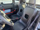 the interior of a car with a seat and steering wheel