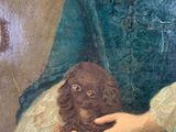 painting of a woman holding a dog in her hands