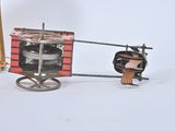 a small toy horse pulling a cart with a box on the back