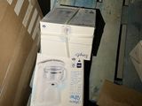 a box that is sitting on the floor next to a box with a toothbrush in it