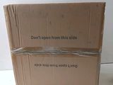 a box that has a sign on it that says don ' t open from this side