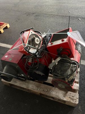 a red motorcycle sitting on a pallet on the street