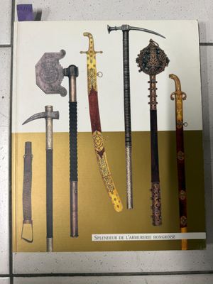 une image représentant un livre sur lequel figurent plusieurs épées