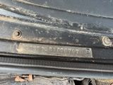 a close up of a metal plate on a car ' s bumper