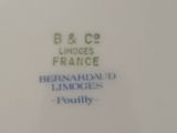 a white plate with a blue and white design on it
