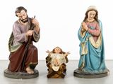 three figurines of jesus and a baby jesus