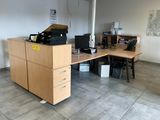 a desk with a chair and a computer on it