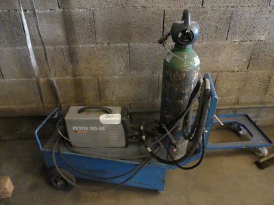 a blue cart with a propanent on top of it