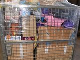 a large metal cart with many boxes in it