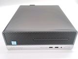 an image of a silver computer with a blue sticker on top of it