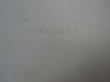 a close up of the writing on the side of a refrigerator
