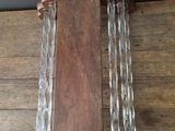 a wooden and glass wall hanging on the wall