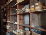 many boxes and boxes on the shelves in the room