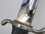 a close up of a sword with a metal handle