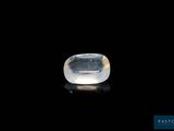 a white quartz stone on a black surface