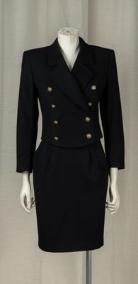 an image of a black dress and jacket on a mannequin