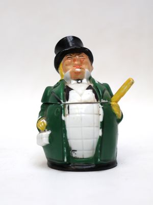 a figurine of a man with a baseball bat in his hand