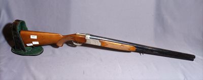 the rifle is sitting on the table ready to be used