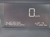 the dashboard of a car with a digital clock showing the time