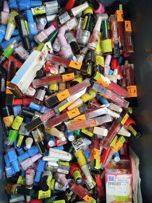 a bin full of various types of cosmetics and makeup products