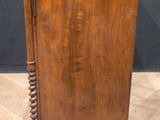 an old wooden cabinet sitting on top of a hard wood floor