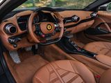 the interior of a sports car with leather seats and a steering wheel