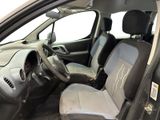 the interior of a small car with a steering wheel and dashboard
