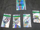 five packets of cbd gum sitting on top of a black surface