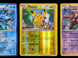 four different pokemon cards are shown in a row on a black background