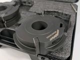 a black case with a pair of tape cutters inside of it