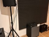 a room with speakers, speakers, and speakers on the floor