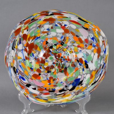an image of a colorful glass bowl on a stand