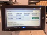 a tablet that is sitting on top of a printer