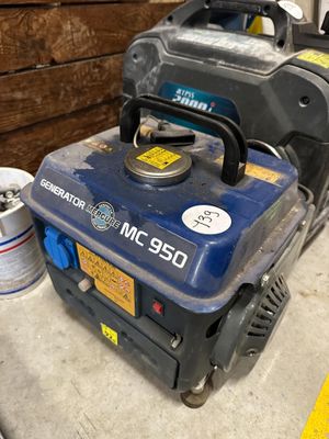 a blue and black generator sitting on a table