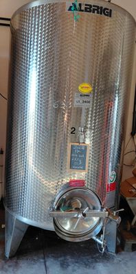 a stainless steel tank that is sitting in a garage