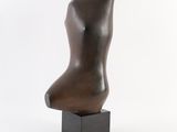 bronze sculpture of a female torso on a square base