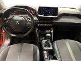 the interior of a car with a steering wheel, dashboard and dashboard controls