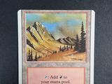 a card with a picture of a mountain in the background