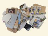 a pile of old stamps and envelopes on a table