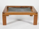 an image of a wooden table with a glass top on a white background