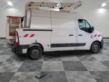 a white truck that is parked in a garage