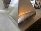 a large metal object on a table in a room