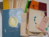 a pile of old books on a white table