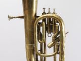 an old brass tuba is shown against a white background