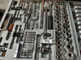 many tools in a toolbox that are sitting on a table
