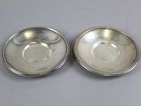 a pair of silver plated bowls with beading on each side